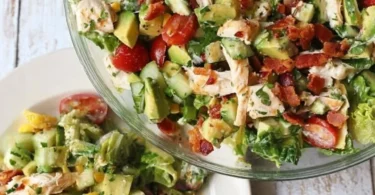 Bacon Avocado Chicken Salad with Lemon Vinaigrette served in a bowl