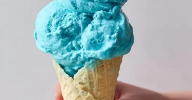 Delicious Blue Moon Ice Cream in a waffle cone