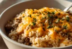 Cheesy Ground Beef and Rice Casserole served in a baking dish