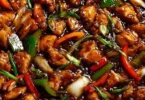 Delicious chicken in garlic sauce garnished with herbs