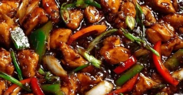 Delicious chicken in garlic sauce garnished with herbs