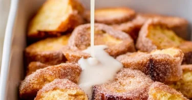 Churro French Toast Casserole topped with Mexican chocolate drizzle