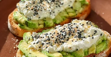 Delicious cottage cheese avocado toast topped with fresh herbs and spices