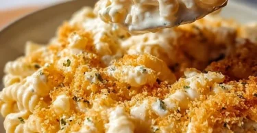 Creamy Boursin Mac and Cheese served in a bowl, topped with herbs.