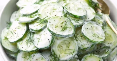 Cucumber Yogurt Salad in a bowl with fresh herbs and spices