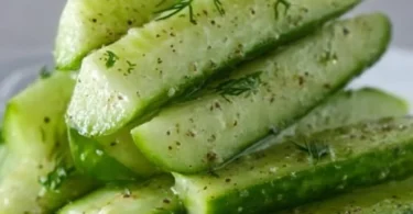 Homemade Garlic Dill Cucumbers in a jar, perfect for snacking and pickling.