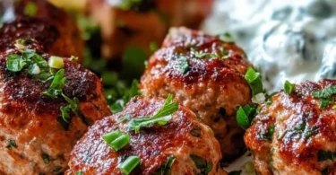 Greek Turkey Meatballs served with Tzatziki sauce on a plate