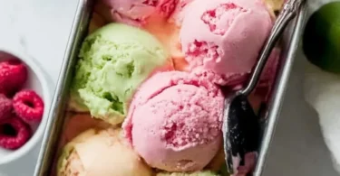 Bowl of colorful homemade rainbow sherbet with vibrant flavors.