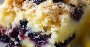 Lemon Blueberry Cheesecake Dump Cake with fresh blueberries and lemon zest