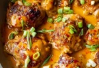 Delicious Skillet Bang Bang Chicken Thighs served with vegetables