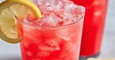 A glass of refreshing watermelon lemonade with mint leaves
